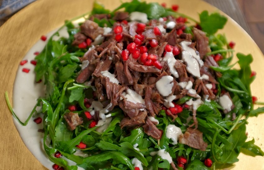 Shredded beef and rocket salad with tahini yoghurt dressing