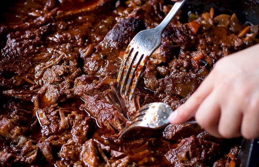 Slow cooked shredded beef sauce